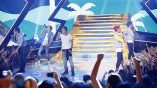 One Direction performing