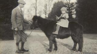 Previously unpublished family photograph issued by the Royal Collection of Queen Elizabeth II with nthe Duke of York on Shetland pony, Peggy in 1930.
