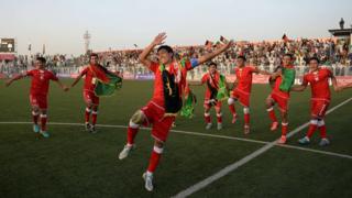 Afghan footballers celebrate their 3-0 win against Pakistan