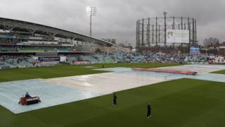 The Kia Oval is covered to protect against rain during the fifth Ashes Test between England and Australia on 22 August 2013