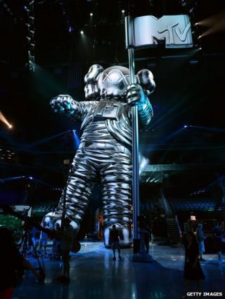 Moonman designed by artist KAWS on display during a press conference for the 2013 MTV Video Music Awards at the Barclays Center on August 22, 2013