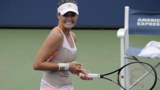 Laura Robson smiles after winning her first round match at the US Open