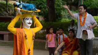 Indian Hindu devotees pray in front of idols of Lord Krishna at a temple in New Delhi on the occasion of Janamashtami. The Hindu festival of Janmashtami today, marks the birth of the Hindu god Lord Krishna.