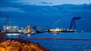 Boats surround the Costa Concordia.