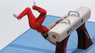 Gymnast Daan Kenis from Belgium falls off the pommel horse, during the qualification round at the artistic gymnastics World Championships in Antwerp, Belgium