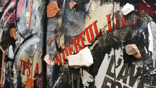 It's a wonderful life message on a wall in tower block art project Tour 13 in Paris