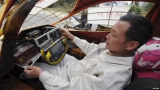 Man sits in home-made car