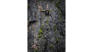 Michal Navratil of the Czech Republic prepares to launch an armstand dive from the 27 metre platform at Maya Bay in the Andaman Sea during the final stop of the 2013 Red Bull