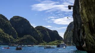 Gary Hunt of the UK dives from the 27 metre platform at Maya Bay in the Andaman Sea during the final stop of the 2013 Red Bull Cliff Diving World Series.