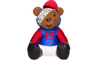 Bear in a blue and red riding outfit.