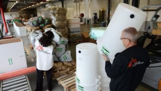 French workers from Doctors without Borders prepare emergency aid for the Philippines.