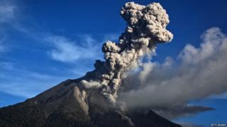 Powerful bursts of hot ash and rocks erupting from Mount Sinabung in Indonesia. Local people have been warned to stay at least 3 miles away from the crater of the volcano.