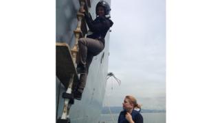 Leah climbing ladder on HMS Daring ship