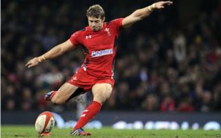 Leigh Halfpenny kicking during a rugby game