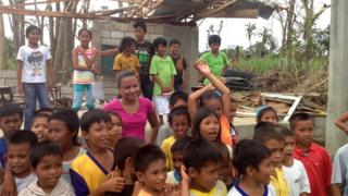Leah with children at school