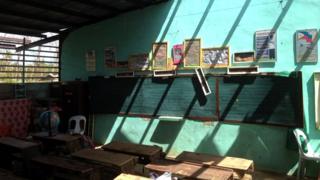 Pupils work in classroom ruined