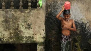 Boy washing.