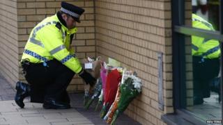 Flowers laid near the scene of the helicopter crash