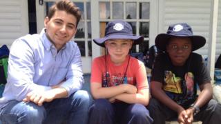 Ricky and children playing cricket in South Africa