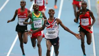 Mo Farah crossing finish line at World Athletics Championships in Moscow.