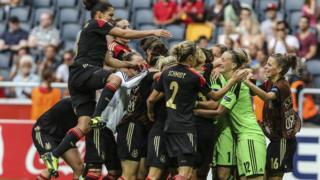 Germany women's football team celebrate on pitch