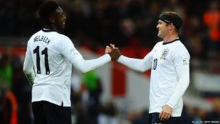 Wayne Rooney and Danny Welbeck shake hands