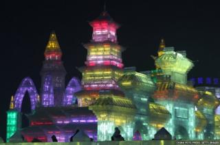 A city made of ice, illuminated in a rainbow of colours