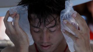 Kei Nishikori of Japan holds an ice pack to his face