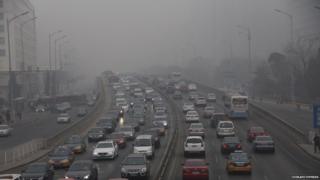 Smog covers a busy highway in Beijing