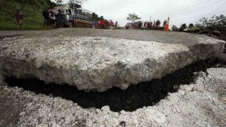 A view of a road damaged by landslides in the southern Philippine island of Mindanao.