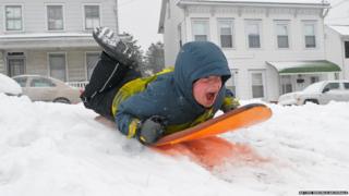 A boy on a sledge