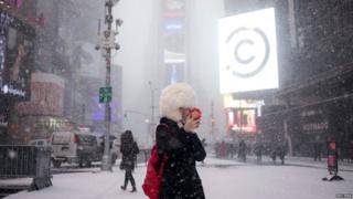 A lady takes a selfie during a snow storm in Times Square, New York