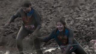 Tough Guy competitors in mud