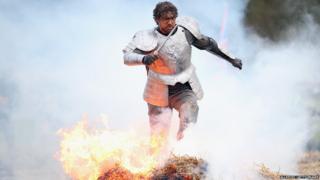 Tough Guy competitor runs through fire