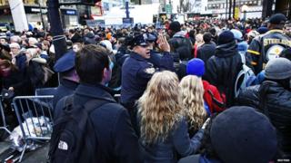 Police officer directs massive crowd