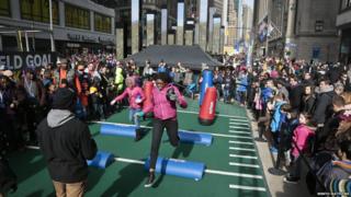 fans play on obstacle course