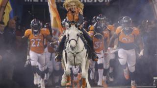 Thunder leads the Denver Broncos players onto the field