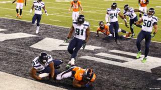 Running back Knowshon Moreno of the Denver Broncos recovers the ball in the endzone.
