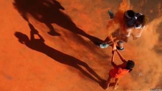 Runners covered in orange paint