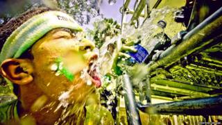 Runner splashed with water and paint