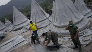 Cone shaped statues wrapped in material