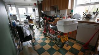 Motorbikes stored in a kitchen