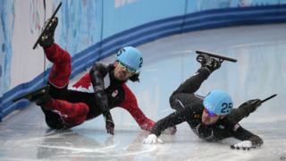 Charles Hamelin from Canada and Eduardo Alvarez from America crash