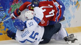 Norway's Henrik Odegaard on top of Finland's Tuomo Ruutu