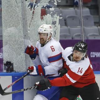 Shattered glass during Austria v Norway ice hockey game