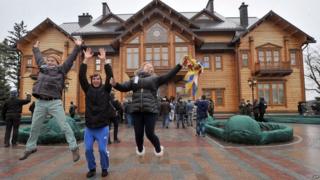 Protestors celebrate in the presidential residence north of Kiev