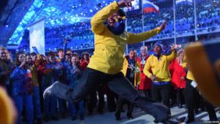 Brazil's bobsleigh athlete Sally Mayara da Silva dancing in a crowd of people