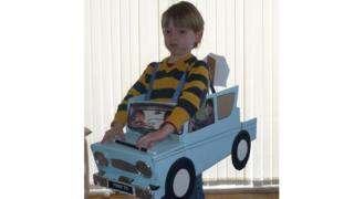 Milo with a cardboard car