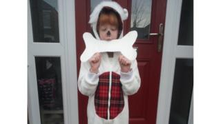 Lily, who's 8, is dressed as Snowy the dog from the Tin-Tin books.