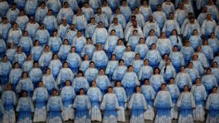 Singers in matching outfits